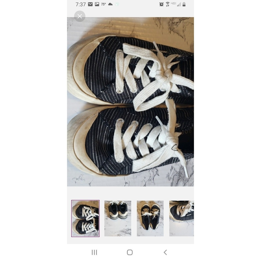 Womens black and white striped Rocket Dog tennis shoes. Lace up. Size 7.5